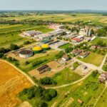 Aerial shot of Hercegovac, Croatia, showing industrial and agricultural landscape.